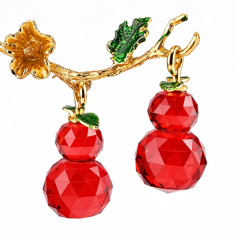LIVMORE Deko-Ornament mit facettierten Glaskürbissen und goldfarbenem Zierzweig, 20x15cm, Grün