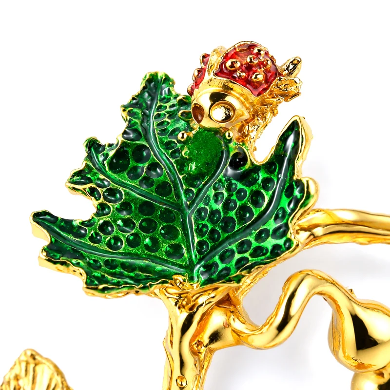 LIVMORE Deko-Ornament mit facettierten Glaskürbissen und goldfarbenem Zierzweig, 20x15cm, Grün