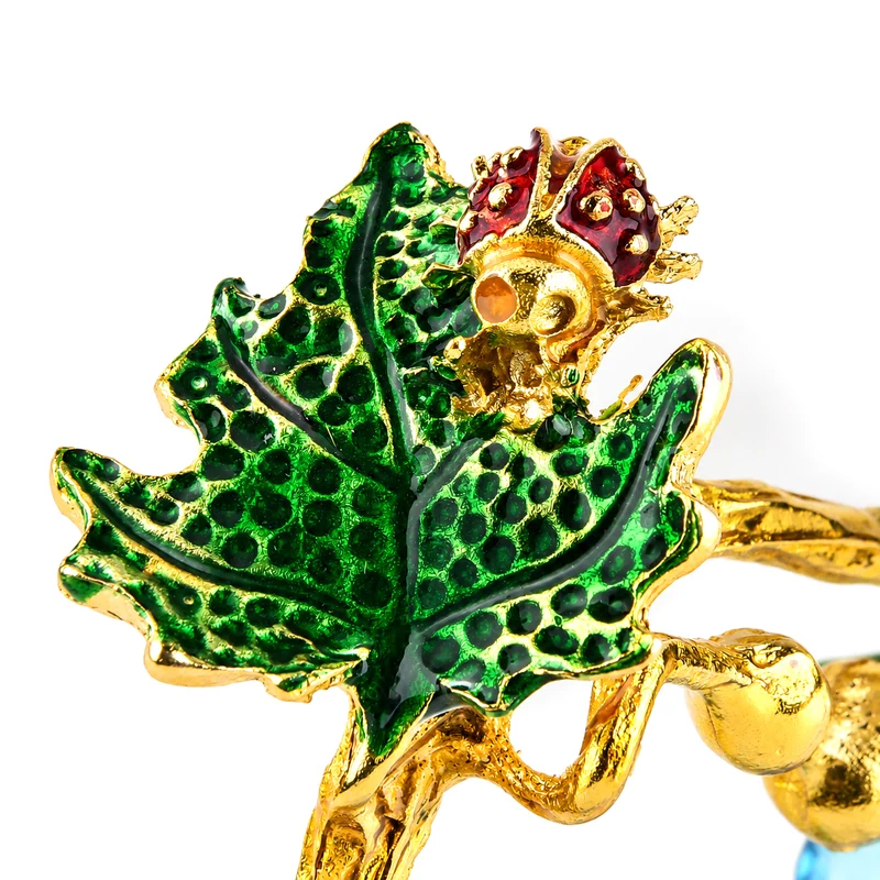 LIVMORE Deko-Ornament mit facettierten Glaskürbissen und goldfarbenem Zierzweig, 20x15cm, Grün