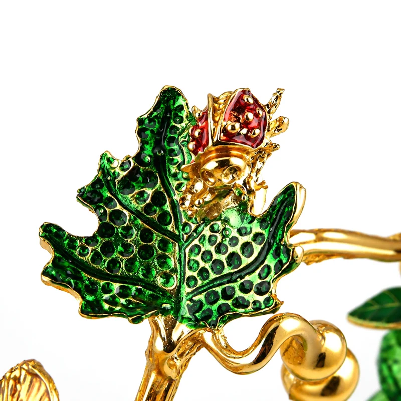 LIVMORE Deko-Ornament mit facettierten Glaskürbissen und goldfarbenem Zierzweig, 20x15cm, Grün