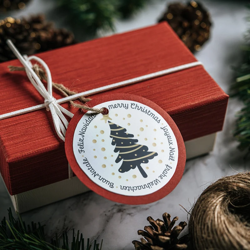 200 Weihnachtsaufkleber auf Rolle Frohe Weihnachten international schwarz gold Ø 5 cm