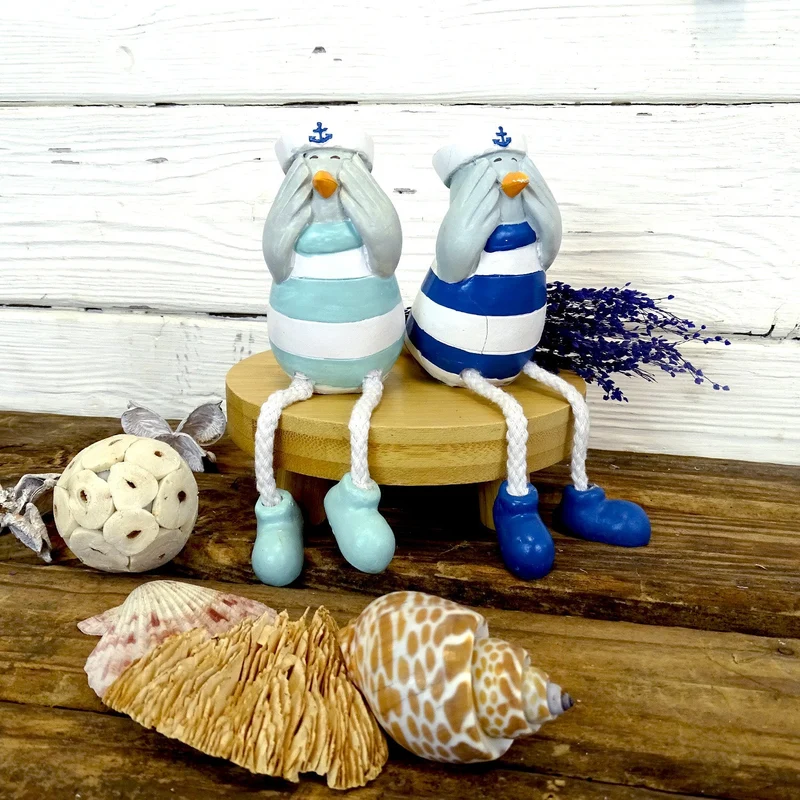 Logbuch-Verlag Deko-Möwen 2er-Set 18x8x4,5 cm – Maritime Figuren aus Polyresin mit baumelnden Beinen – Seemöwen blau-weiß für Fensterbank